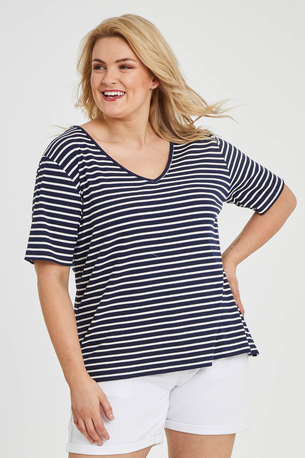 Model Keeara wearing size 16 of The Keepers V Neck Striped Rib Tee in colour Navy (Blue), from the front, cropped image