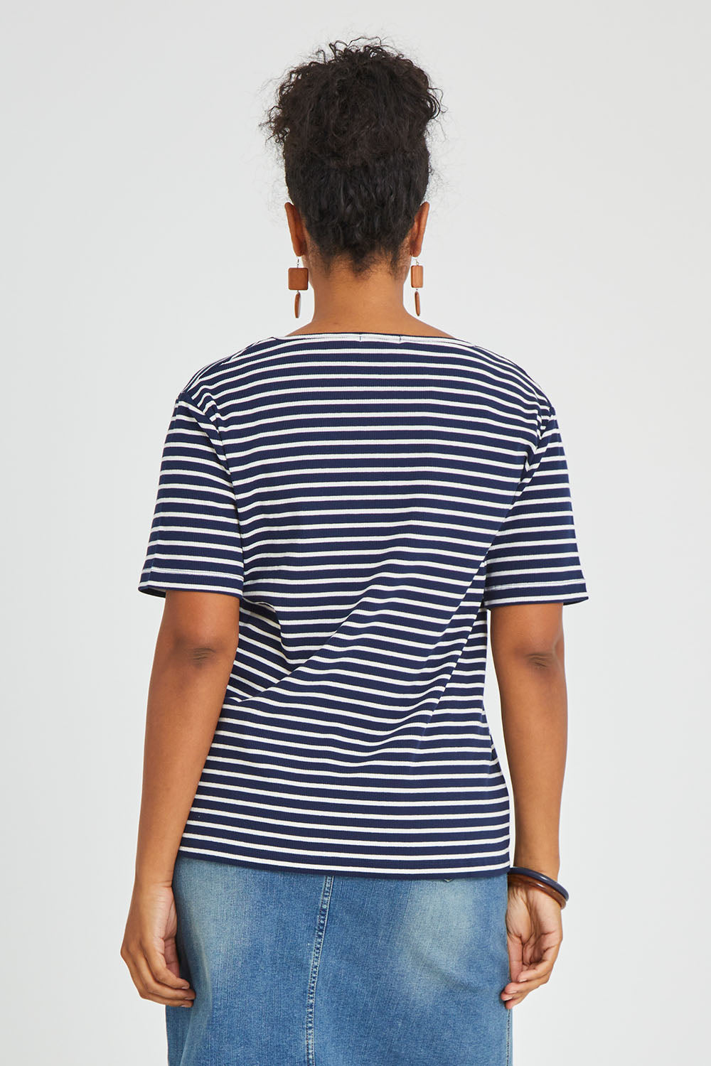 Model Noli wearing size 14 of The Keepers V Neck Striped Rib Tee in colour Navy (Blue), from the back