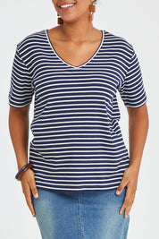 Model Noli wearing size 14 of The Keepers V Neck Striped Rib Tee in colour Navy (Blue), from the front, cropped image