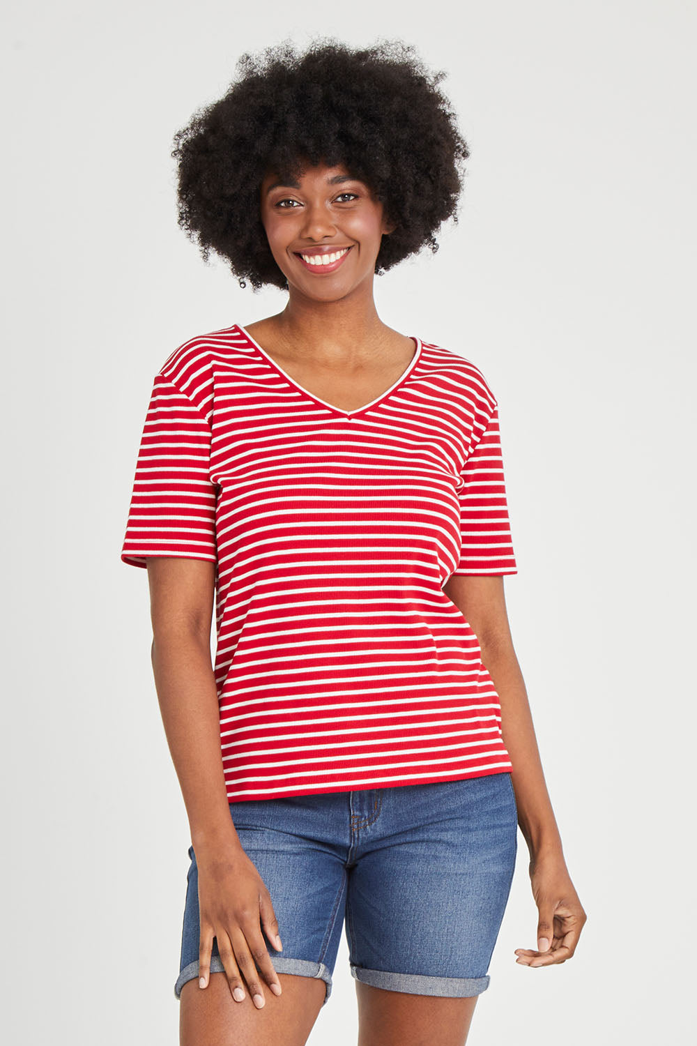 Model Aiyana wearing size 10 of The Keepers V Neck Striped Rib Tee in colour Red (Red), from the front, cropped image