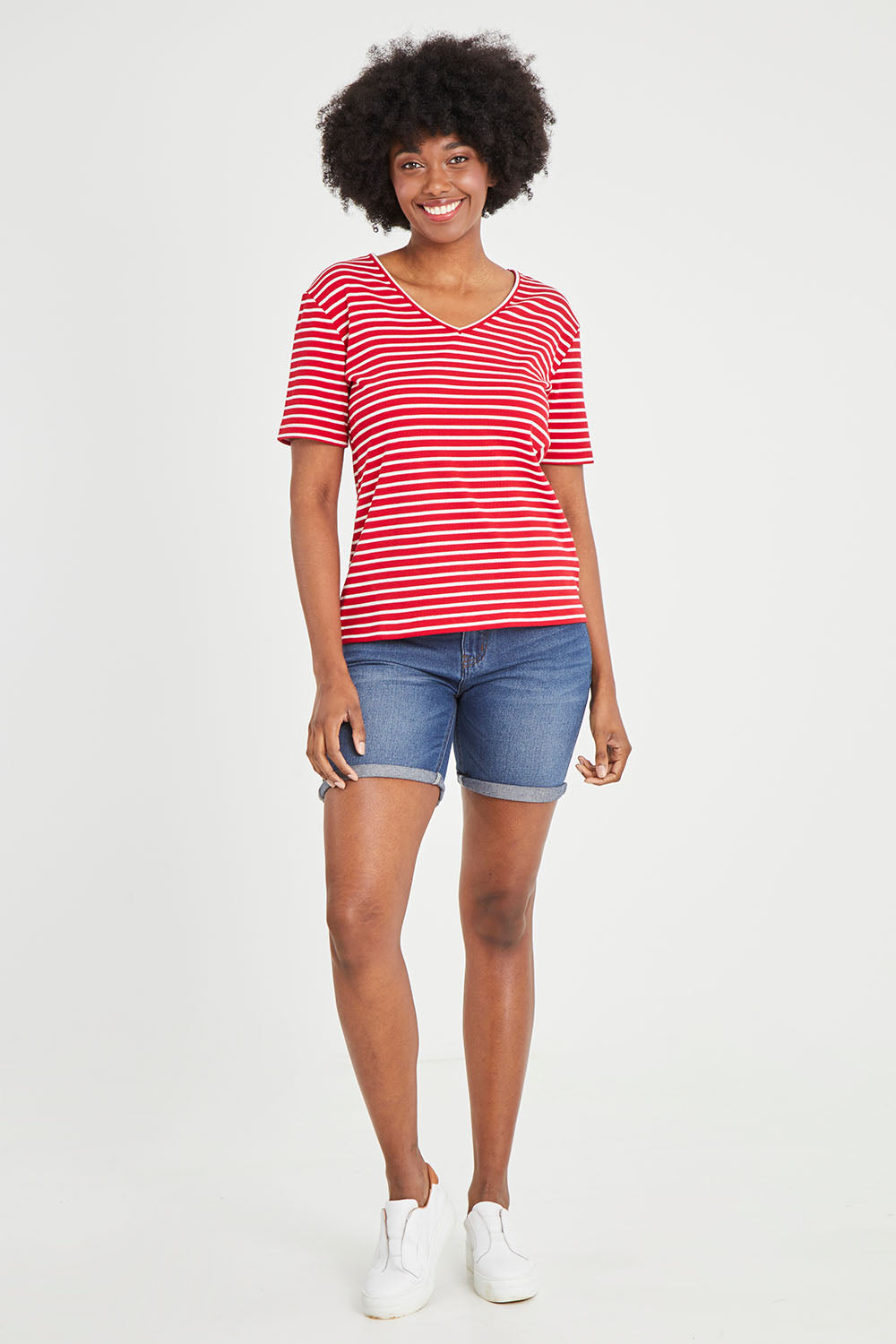 Model Aiyana wearing size 10 of The Keepers V Neck Striped Rib Tee in colour Red (Red), from the front, showing the whole outfit