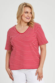 Model Keeara wearing size 16 of The Keepers V Neck Striped Rib Tee in colour Red (Red), from the front, cropped image