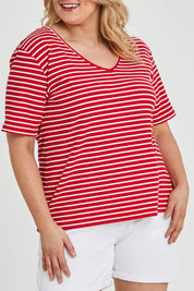 Model Keeara wearing size 16 of The Keepers V Neck Striped Rib Tee in colour Red (Red), from the front, cropped image