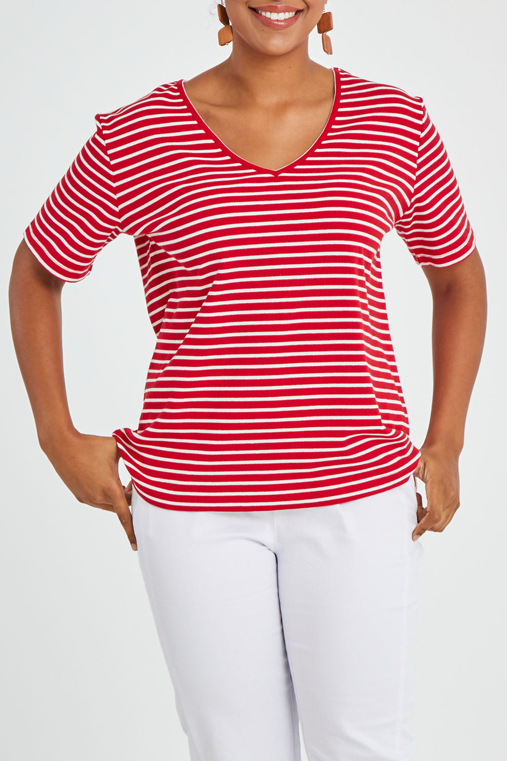 Model Noli wearing size 14 of The Keepers V Neck Striped Rib Tee in colour Red (Red), from the front, cropped image