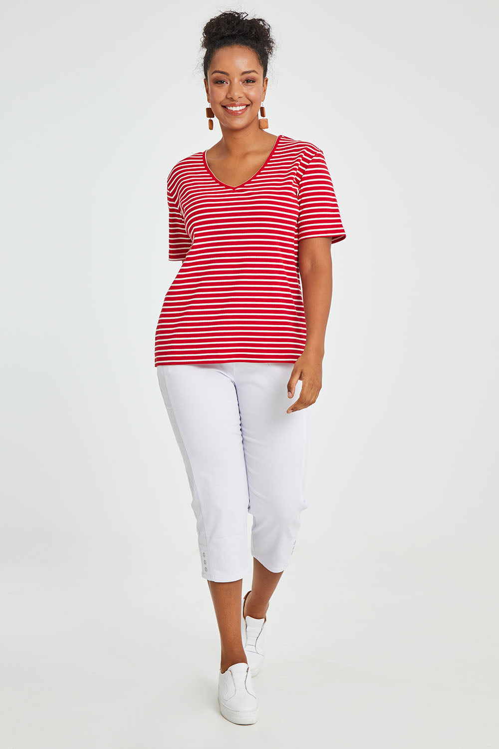 Model Noli wearing size 14 of The Keepers V Neck Striped Rib Tee in colour Red (Red), from the front, showing the whole outfit