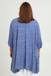 Model Monique wearing size 14 of The Perfect Summer Knit Cardi in colour Denimmarle (Blue), from the back