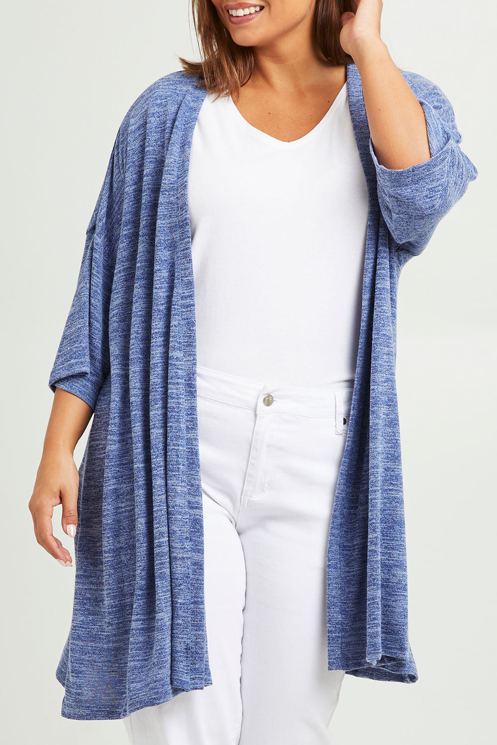 Model Monique wearing size 14 of The Perfect Summer Knit Cardi in colour Denimmarle (Blue), from the front, cropped image
