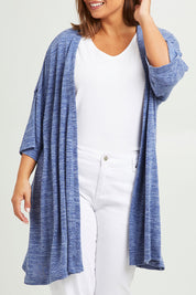 Model Monique wearing size 14 of The Perfect Summer Knit Cardi in colour Denimmarle (Blue), from the front, cropped image