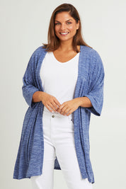 Model Monique wearing size 14 of The Perfect Summer Knit Cardi in colour Denimmarle (Blue), from the front, cropped image