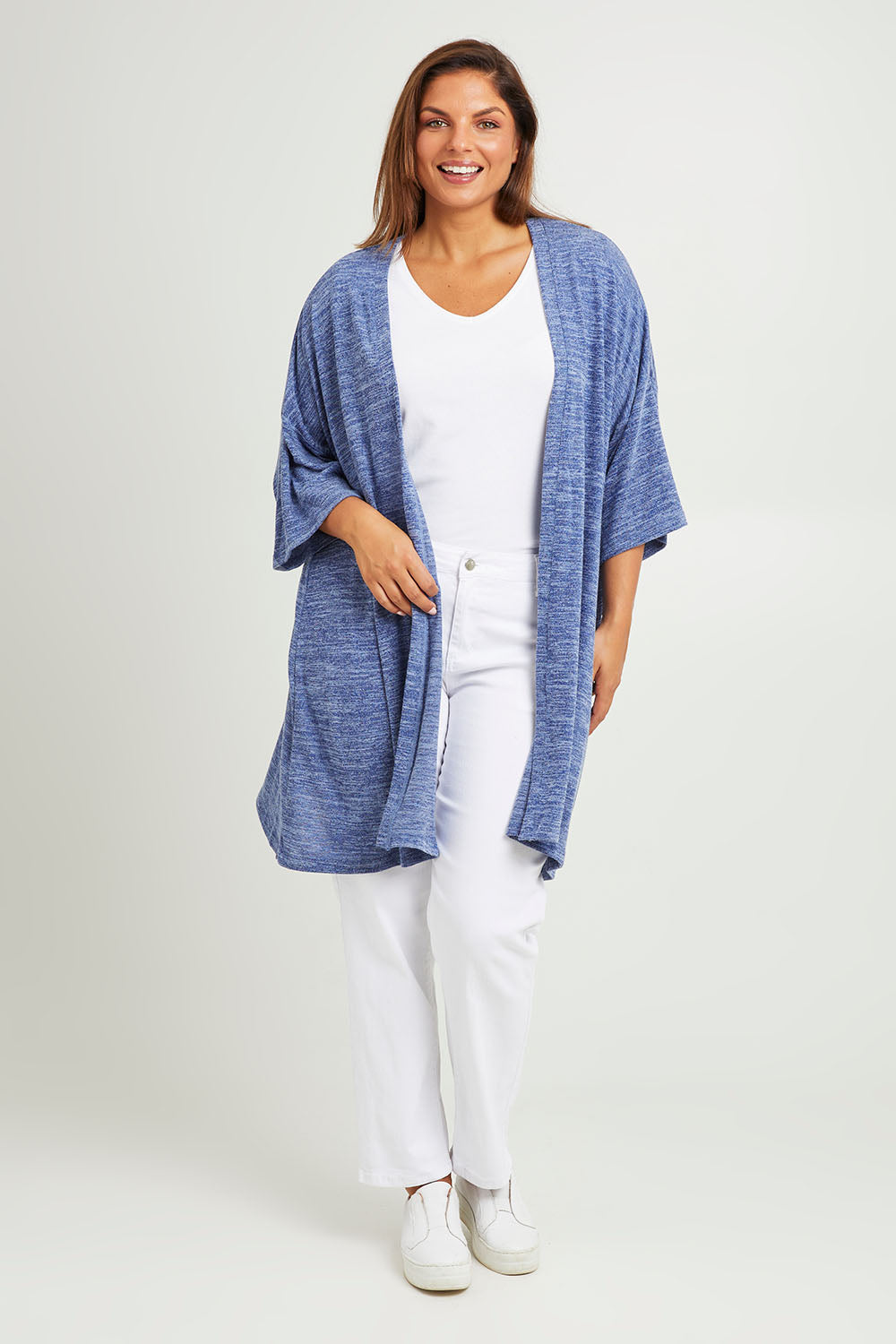 Model Monique wearing size 14 of The Perfect Summer Knit Cardi in colour Denimmarle (Blue), from the front, showing the whole outfit