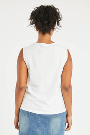 Model Noli wearing size 14 of The Keepers Classic Tank in colour White (White), from the back