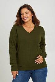 Model Monique wearing size L of The Keepers Soft V Neck Jumper in colour Darkolive (Green), from the front, cropped image