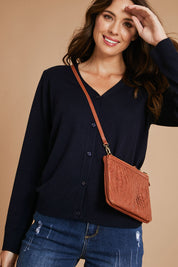 Model Madeline wearing size S of The Keepers Soft Button Up Cardigan in colour Deepnavy (Blue), from the front, showing the whole outfit