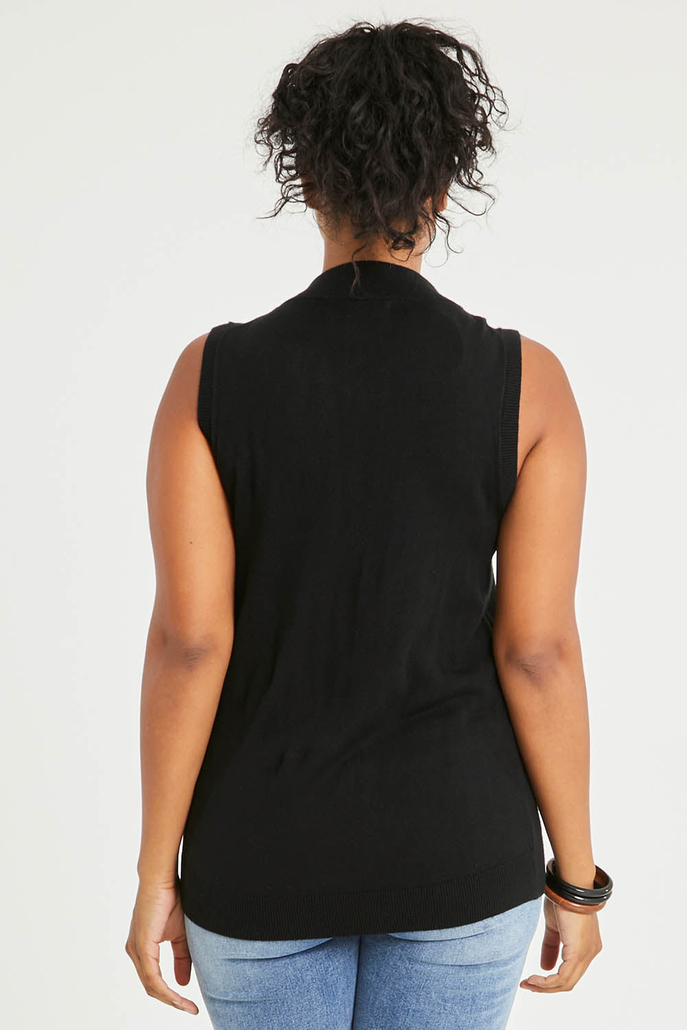 Model Noli wearing size L of The Soft Sleeveless Mockturtle Jumper in colour Black (Black), from the back
