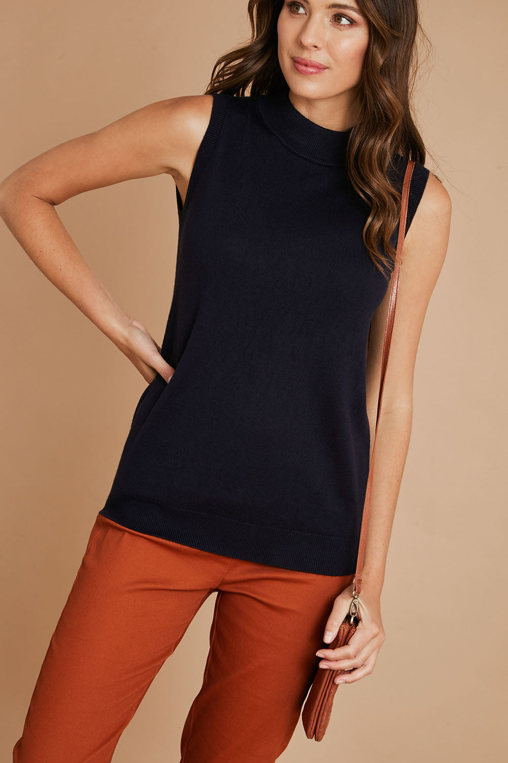 Model Madeline wearing size S of The Soft Sleeveless Mockturtle Jumper in colour Darknavy (Blue), from the front, cropped image