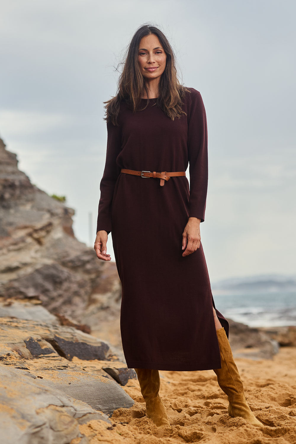 Model Madeline wearing size S of The Keepers Soft Knit Maxi Dress in colour Plum (Purple), from the front, showing the whole outfit
