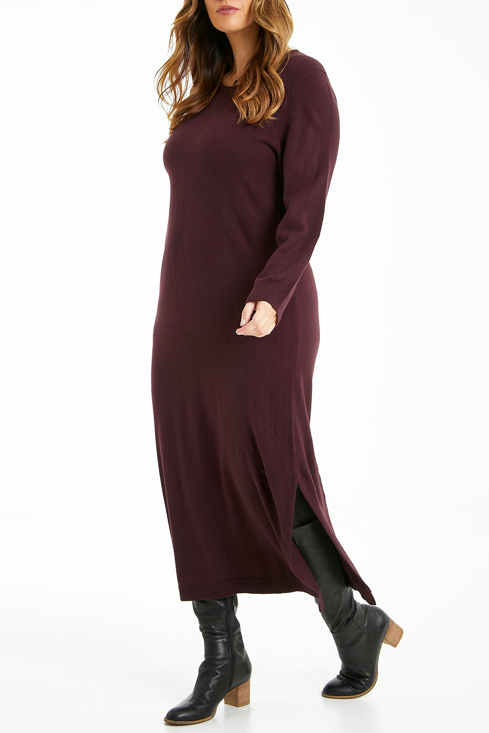 Model Laura wearing size L of The Keepers Soft Knit Maxi Dress in colour Woodberry (Purple), from the front, cropped image