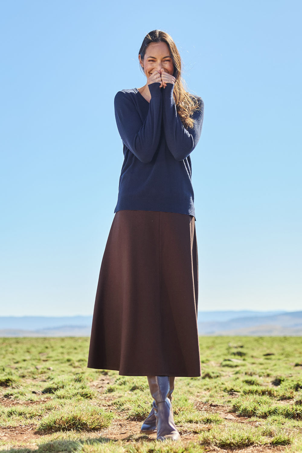 Model Amanda wearing size 10 of The Fit And Flare Ponte Skirt in colour Chocolate, from the front, showing the whole outfit