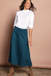 Model Amanda wearing size 10 of The Fit And Flare Ponte Skirt in colour Teal (Blue), from the front, showing the whole outfit