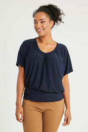 Model Noli wearing size 14 of The Recycled V Neck Wide Band Tee in colour Navy (Blue), from the front, cropped image