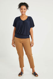Model Noli wearing size 14 of The Recycled V Neck Wide Band Tee in colour Navy (Blue), from the front, showing the whole outfit