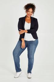 Model Alexis wearing size 16 of The Everyday Long Sleeve Blazer in colour Darknavy (Blue), from the front, showing the whole outfit