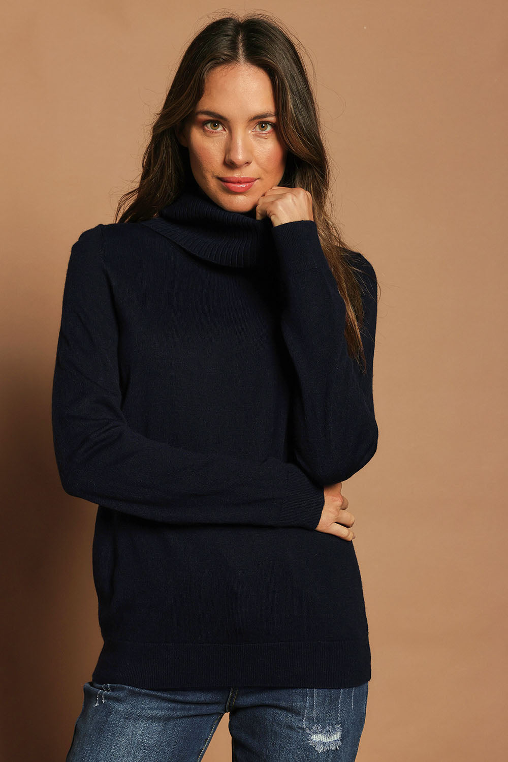 Model Madeline wearing size S of The Keepers Soft Roll Neck Jumper in colour Darknavy (Blue), from the front, showing the whole outfit