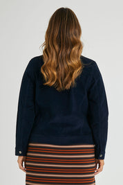 Model Laura wearing size 14 of The Cord Casual Jacket in colour Navy (Blue), from the back