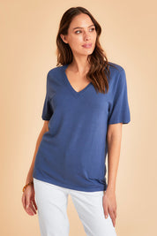 Model Madeline wearing size S of The Transeasonal Short Sleeve Jumper in colour Blueberry (Blue), from the front, showing the whole outfit