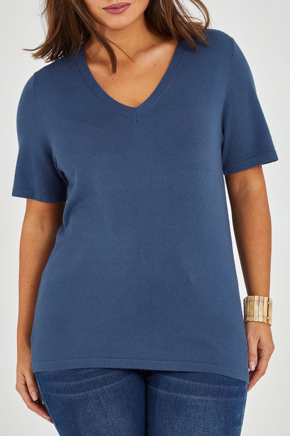 Model Monique wearing size L of The Transeasonal Short Sleeve Jumper in colour Blueberry (Blue), from the front, cropped image