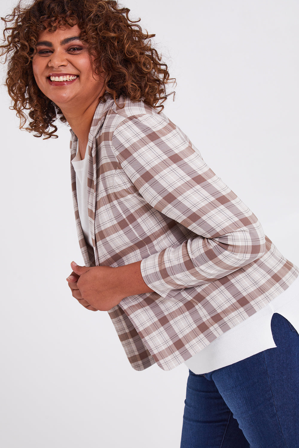 Model Anucia wearing size 14 of The Classic Check Blazer in colour Fawncheck, from the front, cropped image