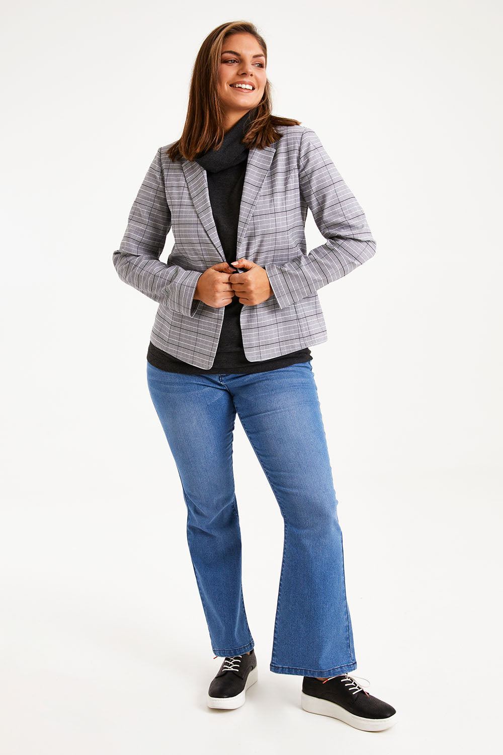Model Monique wearing size 14 of The Classic Check Blazer in colour Greycheck (Grey), from the front, showing the whole outfit