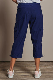 Model Amanda wearing size 10 of The Everyday Cropped Cargo Pant in colour Frenchblue (Blue), from the back