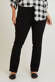 Model Laura wearing size 14 of The Stretch Coloured Denim Jean in colour Black (Black), from the front, cropped image