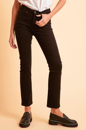 Model Madeline wearing size 10 of The Stretch Coloured Denim Jean in colour Black (Black), from the front, showing the whole outfit