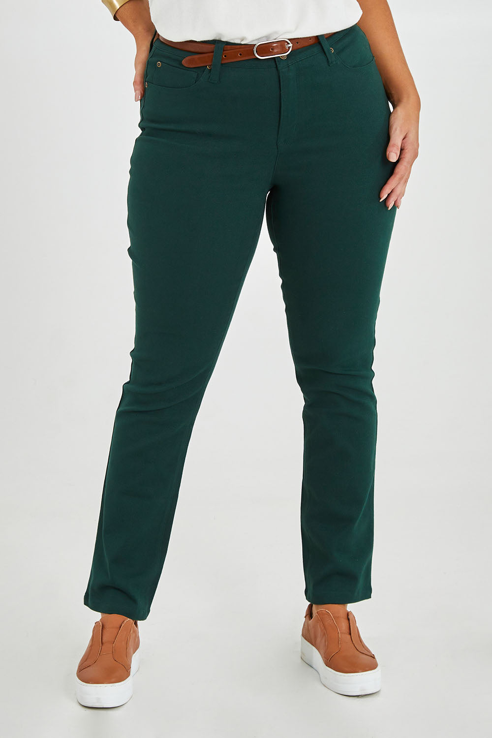 Model Monique wearing size 14 of The Stretch Coloured Denim Jean in colour Peacock (Blue), from the front, cropped image