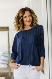 Model Emma wearing size 10 of The Check Pocket Detail Top in colour Navy (Blue), from the front, showing the whole outfit