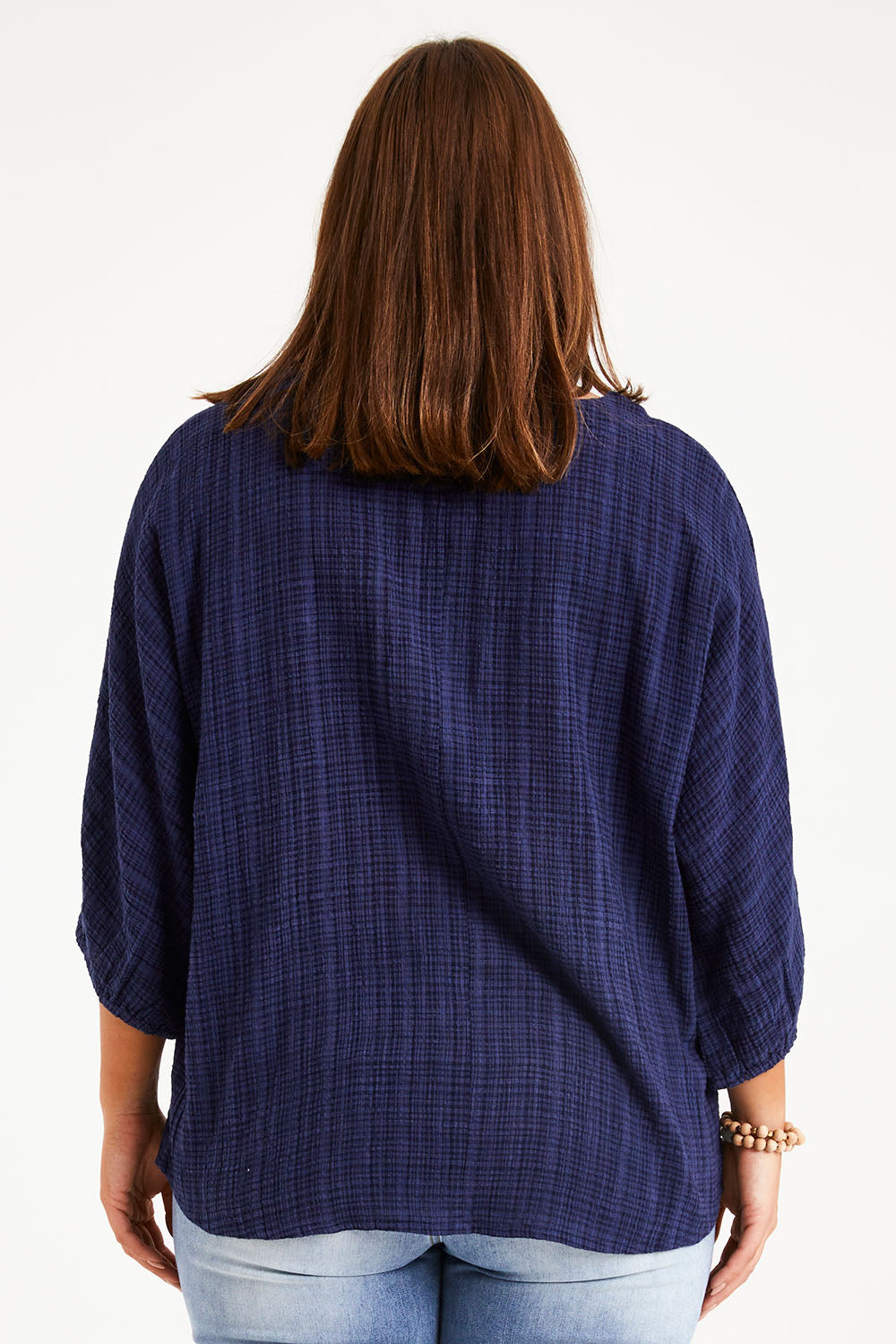 Model Monique wearing size 14 of The Check Pocket Detail Top in colour Navy (Blue), from the back