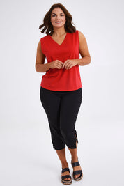 Model Monique wearing size 14 of The Keepers Cotton Tank in colour Red (Red), from the front, showing the whole outfit