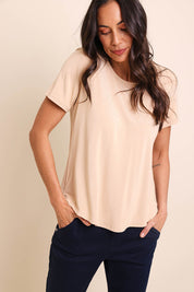 Model Amandam wearing size 10 of the The Bamboo Curved Hem Tee – Almond in colour Almond, in a cropped view