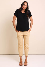 Model Amandam wearing size 10 of the The Bamboo Curved Hem Tee – Black in colour Black, from the front