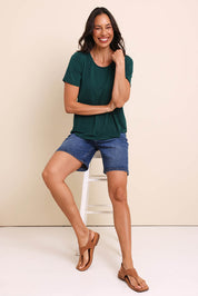 Model Amandam wearing size 10 of the The Bamboo Curved Hem Tee – Forest in colour Forest, from the front