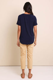 Model Amandam wearing size 10 of the The Bamboo Curved Hem Tee – Navy in colour Navy, from the front