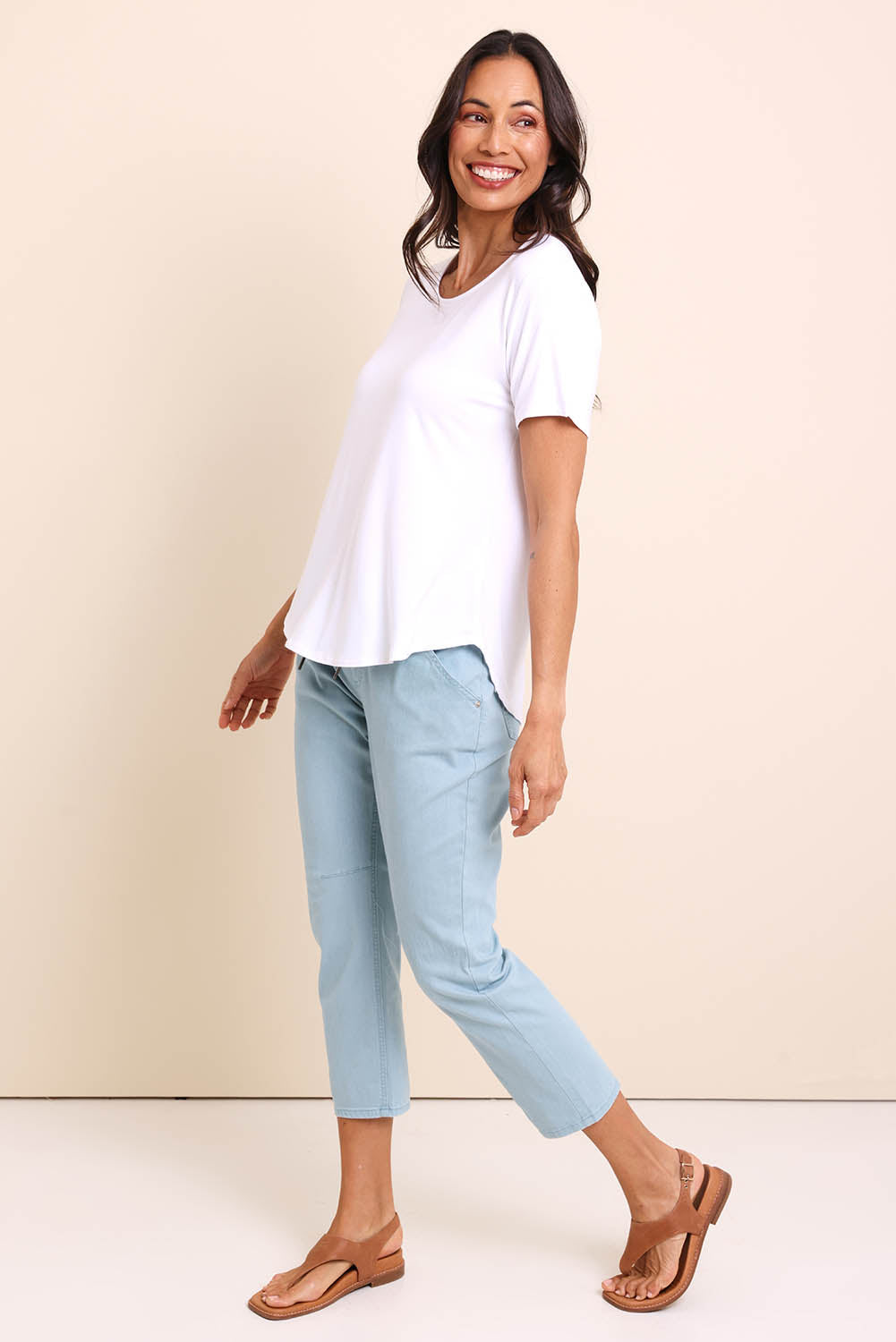 Model Amandam wearing size 10 of the The Bamboo Curved Hem Tee – White in colour White, from the front