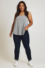 Model Ashleigh wearing size 16 of The Bamboo Crew Neck Swing Tank in colour Greymarle (Grey), from the front, showing the whole outfit