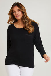 Model Laura wearing size 14 of The Relaxed Satin Bind Tee in colour Black (Black), from the front, cropped image