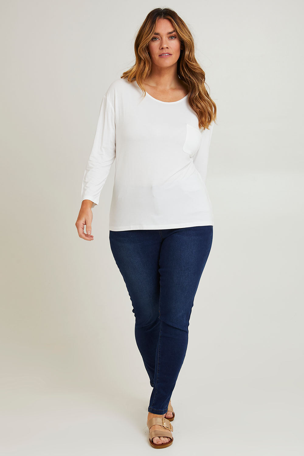 Model Laura wearing size 14 of The Relaxed Satin Bind Tee in colour White (White), from the front, showing the whole outfit