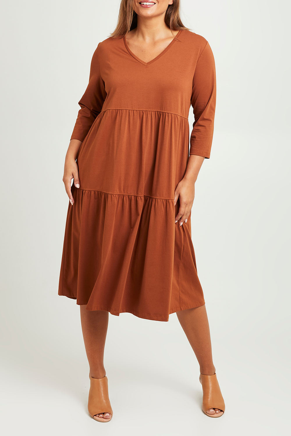 Model Monique wearing size 14 of The 3/4 Sleeve Tiered Jersey Dress in colour Nutmeg, from the front, cropped image
