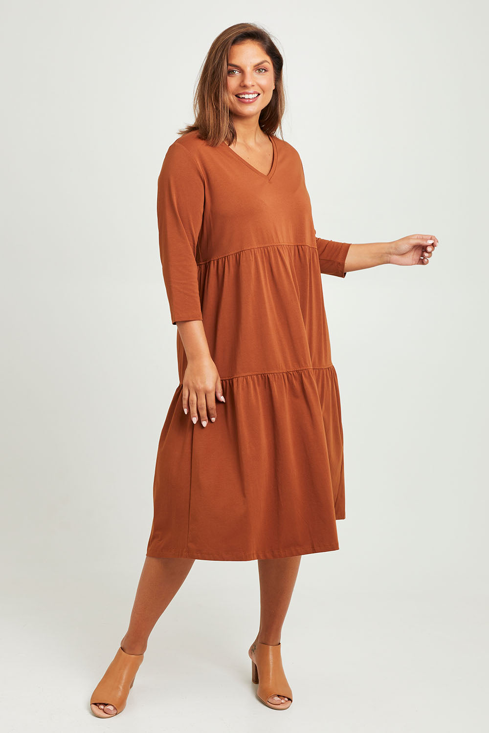 Model Monique wearing size 14 of The 3/4 Sleeve Tiered Jersey Dress in colour Nutmeg, from the front, showing the whole outfit