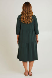 Model Laura wearing size 14 of The 3/4 Sleeve Tiered Jersey Dress in colour Thymegreen (Green), from the back